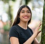 A shallow focus shot of a smiling young female - happiness concept